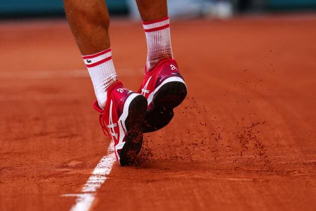 Mandatory Credit: Photo by Javier Garcia BPI Shutterstock (12058128ir) The Asics tennis shoes of Novak Djokovic French Open Tennis, Day Thirteen, Roland Garros, Paris, France - 11 Jun 2021 French Open Tennis, Day Thirteen, Roland Garros, Paris, France - 11 Jun 2021  Copyright: xJavierxGarcia BPI Shutterstockx 12058128ir