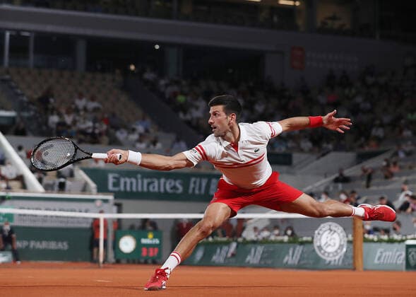 (210612) -- PARIS, June 12, 2021 -- Novak Djokovic of Serbia returns the ball during the men s singles semifinal against Rafael Nadal of Spain at the French Open tennis tournament at Roland Garros in Paris, France, June 11, 2021. ) (SP)FRANCE-PARIS-TENNIS-ROLAND GARROS-FRENCH OPEN-MEN S SINGLES-SEMIFINALS GaoxJing 