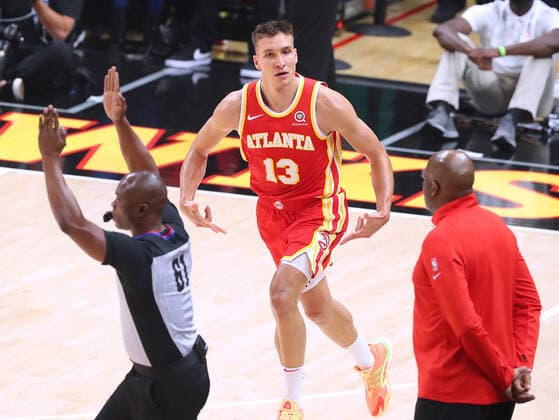 June 11, 2021, Atlanta, GA, USA: The Atlanta Hawks Bogan Bogdanovic reacts to hitting a 3-pointer against the Philadelphia 76ers with interim head coach Nate McMillan looking on in Game 3 of their Eastern Conference semifinal at State Farm Arena on Friday, June 11, 2021, in Atlanta. The Sixers won, 127-111, for a 2-1 series lead. Atlanta USA - ZUMAm67_ 0121187664st Copyright: xCurtisxComptonx
