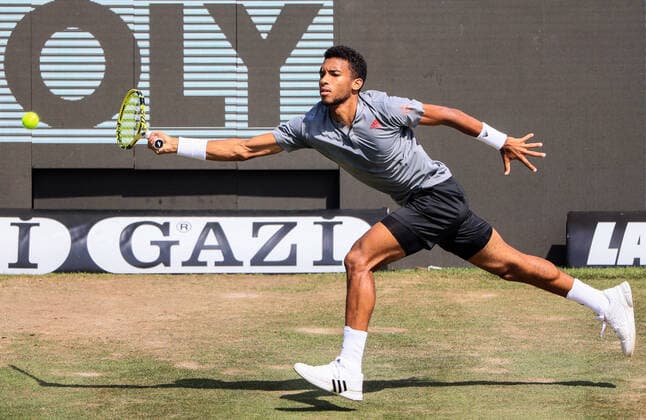 (210612) -- STUTTGART, June 12, 2021 -- Felix Auger-Aliassime returns the ball during the men s singles semifinal of Mercedes Cup between Felix Auger-Aliassime of Canada and Sam Querrey of the United States in Stuttgart, Germany, June 12, 2021. (Photo by Xinhua) (SP)GERMANY-STUTTGART-TENNIS-MERCEDES CUP-MEN S SINGLES-SEMIFINALS PhilippexRuiz 