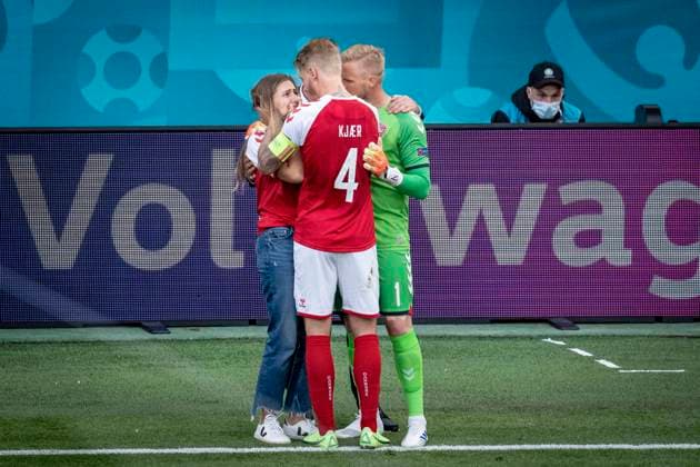 Denmarks Kasper Schmeichel and Denmarks Simon Kjaer while Denmarks Christian Eriksen receives treatment during the match between Denmark and Finland in group B during EURO2020 in the Park in Copenhagen, Saturday 12 June 2021, Copenhagen Denmark  Copyright: RitzauxScanpix MadsxClausxRasmussenx cop101 spdk20210612-195031-L