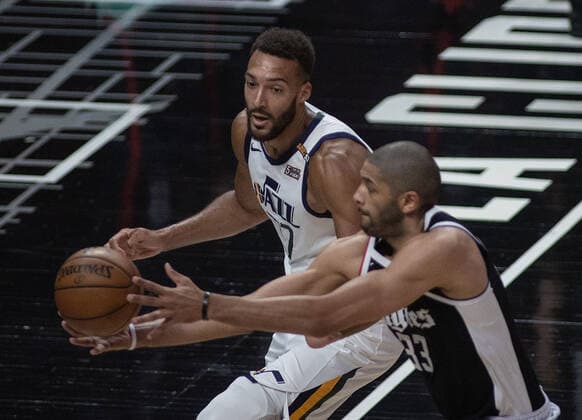 June 12, 2021, Los Angeles, California, USA: Nicolas Batum 33 of the Los Angeles Clippers battles for the ball with Rudy Gobert 27 of the Utah Jazz during Round 2, Game 3 of the 2021 NBA, Basketball Herren, USA Playoffs on Saturday June 12, 2021 at the Staples Center in Los Angeles, California. PI Los Angeles USA - ZUMAp124 20210612_zaa_p124_008 Copyright: xJAVIERxROJASx