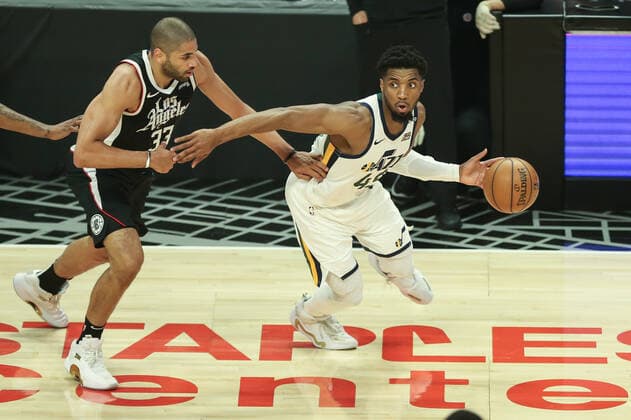 LOS ANGELES, CA - JUNE 12: Utah Jazz guard Donovan Mitchell (45) slips past LA Clippers forward Nicolas Batum (33) during game 3 of the second round of the NBA, Basketball Herren, USA Western Conference playoffs between the Utah Jazz and the Los Angeles Clippers on June 12, 2021, at Staples Center in Los Angeles, CA. (Photo by Jevone Moore Icon Sportswire) NBA: JUN 12 Western Conference Playoffs Second Round - Jazz at Clippers Icon210612032