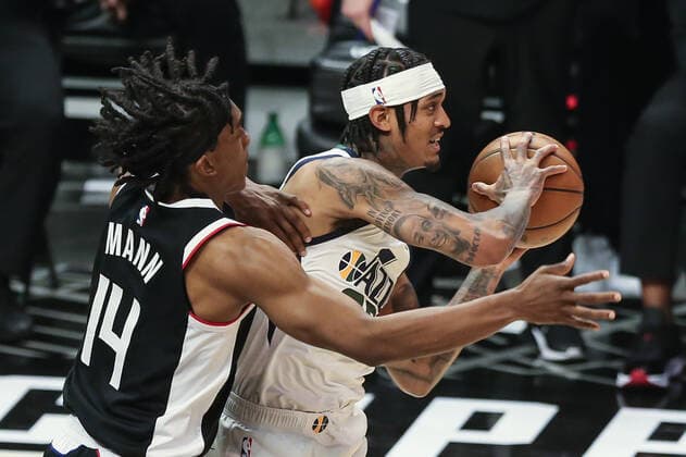 LOS ANGELES, CA - JUNE 12: LA Clippers guard Terance Mann (14) playing close defense on Utah Jazz guard Jordan Clarkson (00) during game 3 of the second round of the NBA, Basketball Herren, USA Western Conference playoffs between the Utah Jazz and the Los Angeles Clippers on June 12, 2021, at Staples Center in Los Angeles, CA. (Photo by Jevone Moore Icon Sportswire) NBA: JUN 12 Western Conference Playoffs Second Round - Jazz at Clippers Icon210612046