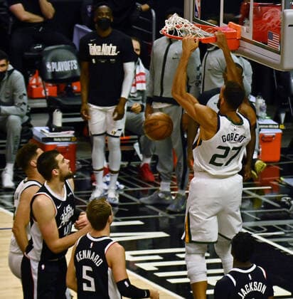 Utah Jazz center Rudy Gobert (27) dunks on Los Angeles Clippers center Ivica Zubac (40) and guard Luke Kennard (5) during the second half of Game 3 of the Western Conference second-round playoffs at Staples Center in Los Angeles on Saturday, June 12, 2021. The Clippers rallied to win another game 3, a 132-106 win over the Utah Jazz that cuts their deficit in this second-round series to 2-1 entering Monday s fourth game.  LAP2021061215 JIMxRUYMEN