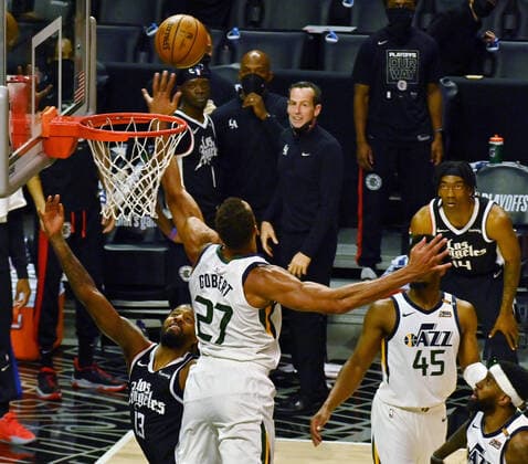 Los Angeles Clippers guard Paul George (13) scores on Utah Jazz center Rudy Gobert (27) during the second half of Game 3 of the Western Conference second-round playoffs at Staples Center in Los Angeles on Saturday, June 12, 2021. The Clippers rallied to win another game 3, a 132-106 win over the Utah Jazz that cuts their deficit in this second-round series to 2-1 entering Monday s fourth game.  LAP2021061218 JIMxRUYMEN