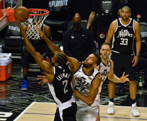 Los Angeles Clippers forward Kawhi Leonard (2) scores on Utah Jazz center Rudy Gobert (27) during the second half of Game 3 of the Western Conference second-round playoffs at Staples Center in Los Angeles on Saturday, June 12, 2021. The Clippers rallied to win another game 3, a 132-106 win over the Utah Jazz that cuts their deficit in this second-round series to 2-1 entering Monday s fourth game.  LAP2021061219 JIMxRUYMEN