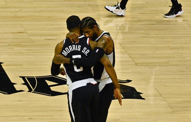 Los Angeles Clippers guard Paul George (R) hugs teammate Marcus Morris Sr. after George hit a three-pointer during the first half of Game 3 of the Western Conference second-round playoffs at Staples Center in Los Angeles on Saturday, June 12, 2021. The Clippers rallied to win another game 3, a 132-106 win over the Utah Jazz that cuts their deficit in this second-round series to 2-1 entering Monday s fourth game.  LAP2021061224 JIMxRUYMEN