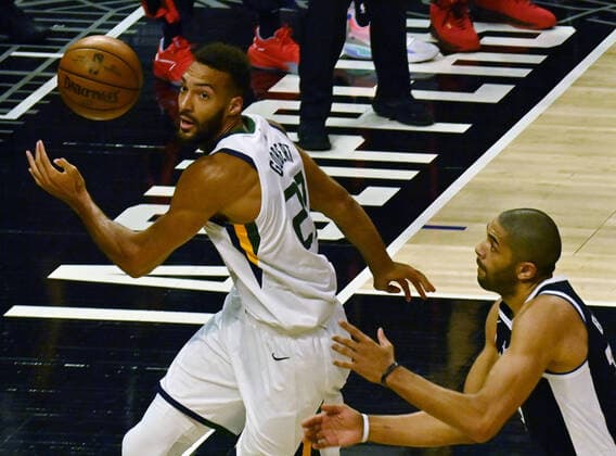 Utah Jazz center Rudy Gobert (27) loses the ball out of bounds under pressure from Los Angeles Clippers forward Nicolas Batum (33) during the first half of Game 3 of the Western Conference second-round playoffs at Staples Center in Los Angeles on Saturday, June 12, 2021. The Clippers rallied to win another game 3, a 132-106 win over the Utah Jazz that cuts their deficit in this second-round series to 2-1 entering Monday s fourth game.  LAP2021061225 JIMxRUYMEN