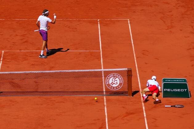 Mandatory Credit: Photo by Javier Garcia BPI Shutterstock (12058233ap) Stefanos Tsitsipas celebrates as Novak Djokovic dives but acnnot reach the ball, in the Men s Singles final French Open Tennis, Day Fifteen, Roland Garros, Paris, France - 13 Jun 2021 French Open Tennis, Day Fifteen, Roland Garros, Paris, France - 13 Jun 2021  Copyright: xJavierxGarcia BPI Shutterstockx 12058233ap