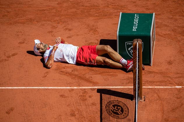 Novak DJOKOVIC of Serbia falls to the ground during his men s single against Stefanos TSITSIPAS of Greece on the Men s Final of the French Open tennis tournament at Roland Garros in Paris, France, 13 June 2021.  Copyright: xAurelienxMorissardx