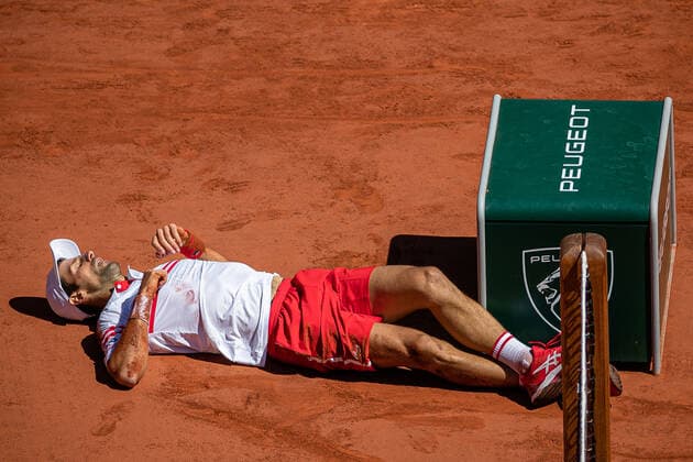 Novak DJOKOVIC of Serbia falls to the ground during his men s single against Stefanos TSITSIPAS of Greece on the Men s Final of the French Open tennis tournament at Roland Garros in Paris, France, 13 June 2021.  Copyright: xAurelienxMorissardx