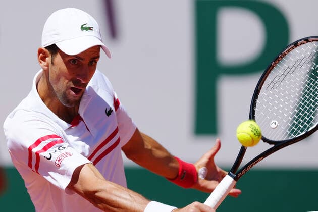 (210613) -- PARIS, June 13, 2021 -- Novak Djokovic hits a return during the men s singles final between Novak Djokovic of Serbia and Stefanos Tsitsipas of Greece at the French Open tennis tournament at Roland Garros in Paris, France, June 13, 2021. ) (SP)FRANCE-PARIS-TENNIS-ROLAND GARROS-FRENCH OPEN-MEN S SINGLES-FINAL GaoxJing 