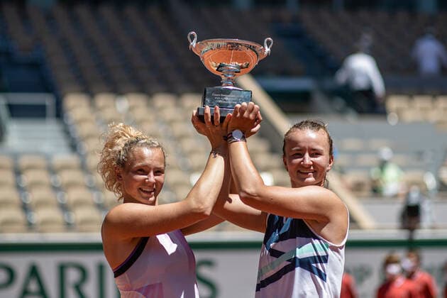 (210613) -- PARIS, June 13, 2021 -- Barbora Krejcikova (R) Katerina Siniakova pose with their trophy after winning the women s doubles final between Barbora Krejcikova Katerina Siniakova of the Czech Republic and Iga Swiatek of Poland Bethanie Mattek-Sands of the United States at the French Open tennis tournament at Roland Garros in Paris, France, June 13, 2021. (Photo by Xinhua) (SP)FRANCE-PARIS-TENNIS-ROLAND GARROS-FRENCH OPEN-WOMEN S DOUBLES-FINAL AurelienxMorissard 