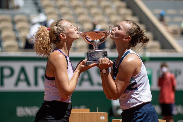 (210613) -- PARIS, June 13, 2021 -- Barbora Krejcikova (R) Katerina Siniakova pose with their trophy after winning the women s doubles final between Barbora Krejcikova Katerina Siniakova of the Czech Republic and Iga Swiatek of Poland Bethanie Mattek-Sands of the United States at the French Open tennis tournament at Roland Garros in Paris, France, June 13, 2021. (Photo by Xinhua) (SP)FRANCE-PARIS-TENNIS-ROLAND GARROS-FRENCH OPEN-WOMEN S DOUBLES-FINAL AurelienxMorissard 