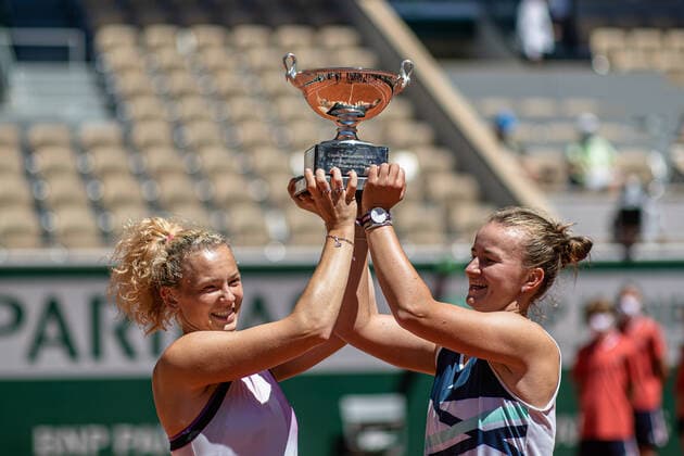 (210613) -- PARIS, June 13, 2021 -- Barbora Krejcikova (R) Katerina Siniakova pose with their trophy after winning the women s doubles final between Barbora Krejcikova Katerina Siniakova of the Czech Republic and Iga Swiatek of Poland Bethanie Mattek-Sands of the United States at the French Open tennis tournament at Roland Garros in Paris, France, June 13, 2021. (Photo by Xinhua) (SP)FRANCE-PARIS-TENNIS-ROLAND GARROS-FRENCH OPEN-WOMEN S DOUBLES-FINAL AurelienxMorissard 