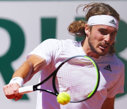 (210613) -- PARIS, June 13, 2021 -- Stefanos Tsitsipas hits a return during the men s singles final between Novak Djokovic of Serbia and Stefanos Tsitsipas of Greece at the French Open tennis tournament at Roland Garros in Paris, France, June 13, 2021. ) (SP)FRANCE-PARIS-TENNIS-ROLAND GARROS-FRENCH OPEN-MEN S SINGLES-FINAL GaoxJing 