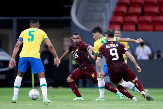 13th June 2021; Mane Garrincha Stadium, Brasilia, Distrito Federal, Brazil; Copa America, Brazil versus Venezuela; Lucas Paquet& xe1; of Brazil tunrs away from Fernando Aristeguieta and Bernaldo Manzano of Venezuela  ActionPlus12296082 AdalbertoxMarques