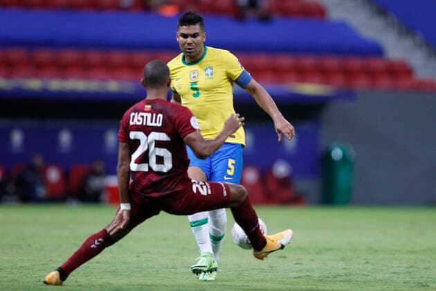 13th June 2021; Mane Garrincha Stadium, Brasilia, Distrito Federal, Brazil; Copa America, Brazil versus Venezuela; Casemiro of Brazil tackled by Castillo of Venezuela  ActionPlus12296102 AdalbertoxMarques