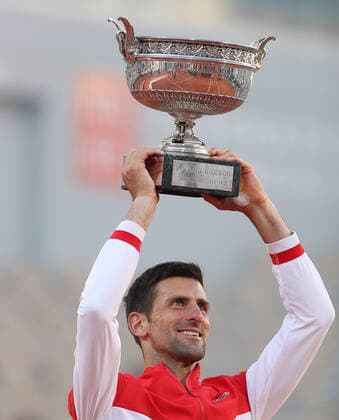 (210614) -- PARIS, June 14, 2021 -- Novak Djokovic of Serbia lifts the trophy after winning the Men s Singles finals match against Stefanos Tsitsipas of Greece at the French Open tennis tournament at Roland Garros in Paris, France, June 13, 2021. ) (SP)FRANCE-PARIS-TENNIS-ROLAND GARROS-FRENCH OPEN-MEN S SINGLES-FINALS GaoxJing 