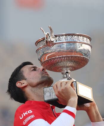 (210614) -- PARIS, June 14, 2021 -- Novak Djokovic of Serbia kisses the trophy after winning the Men s Singles finals match against Stefanos Tsitsipas of Greece at the French Open tennis tournament at Roland Garros in Paris, France, June 13, 2021. ) (SP)FRANCE-PARIS-TENNIS-ROLAND GARROS-FRENCH OPEN-MEN S SINGLES-FINALS GaoxJing 
