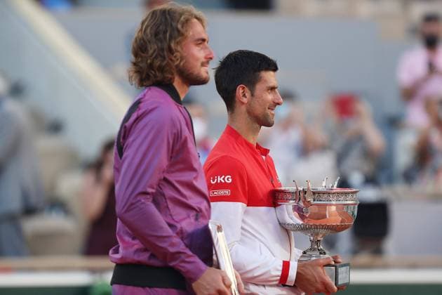 (210614) -- PARIS, June 14, 2021 -- Novak Djokovic (R) of Serbia and Stefanos Tsitsipas of Greece react after their Men s Singles finals match at the French Open tennis tournament at Roland Garros in Paris, France, June 13, 2021. ) (SP)FRANCE-PARIS-TENNIS-ROLAND GARROS-FRENCH OPEN-MEN S SINGLES-FINALS GaoxJing 