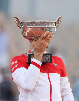(210614) -- PARIS, June 14, 2021 -- Novak Djokovic of Serbia celebrates with the trophy after winning the Men s Singles finals match against Stefanos Tsitsipas of Greece at the French Open tennis tournament at Roland Garros in Paris, France, June 13, 2021. ) (SP)FRANCE-PARIS-TENNIS-ROLAND GARROS-FRENCH OPEN-MEN S SINGLES-FINALS GaoxJing 