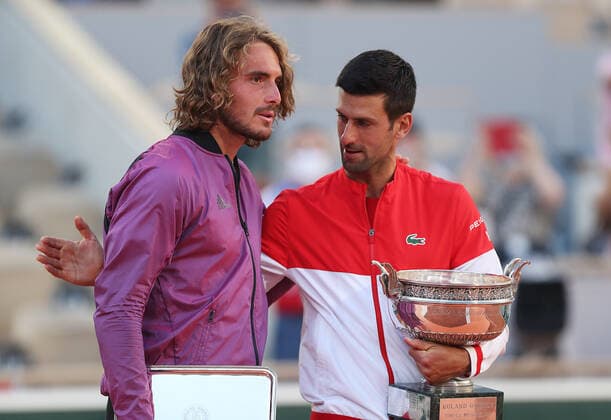 (210614) -- PARIS, June 14, 2021 -- Novak Djokovic (R) of Serbia and Stefanos Tsitsipas of Greece react after their Men s Singles finals match at the French Open tennis tournament at Roland Garros in Paris, France, June 13, 2021. ) (SP)FRANCE-PARIS-TENNIS-ROLAND GARROS-FRENCH OPEN-MEN S SINGLES-FINALS GaoxJing 