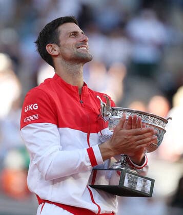 (210614) -- PARIS, June 14, 2021 -- Novak Djokovic of Serbia celebrates with the trophy after winning the Men s Singles finals match against Stefanos Tsitsipas of Greece at the French Open tennis tournament at Roland Garros in Paris, France, June 13, 2021. ) (SP)FRANCE-PARIS-TENNIS-ROLAND GARROS-FRENCH OPEN-MEN S SINGLES-FINALS GaoxJing 