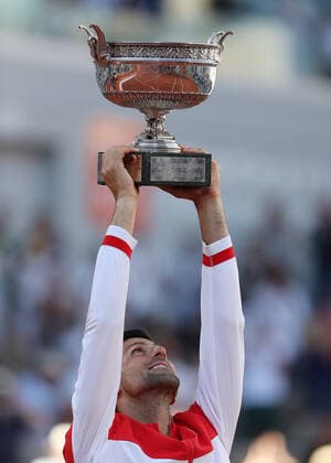 (210614) -- PARIS, June 14, 2021 -- Novak Djokovic of Serbia lifts the trophy after winning the Men s Singles finals match against Stefanos Tsitsipas of Greece at the French Open tennis tournament at Roland Garros in Paris, France, June 13, 2021. ) (SP)FRANCE-PARIS-TENNIS-ROLAND GARROS-FRENCH OPEN-MEN S SINGLES-FINALS GaoxJing 