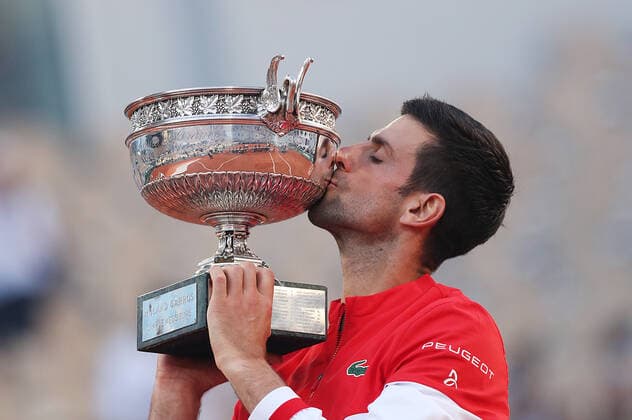 (210614) -- PARIS, June 14, 2021 -- Novak Djokovic of Serbia kisses the trophy after winning the Men s Singles finals match against Stefanos Tsitsipas of Greece at the French Open tennis tournament at Roland Garros in Paris, France, June 13, 2021. ) (SP)FRANCE-PARIS-TENNIS-ROLAND GARROS-FRENCH OPEN-MEN S SINGLES-FINALS GaoxJing 