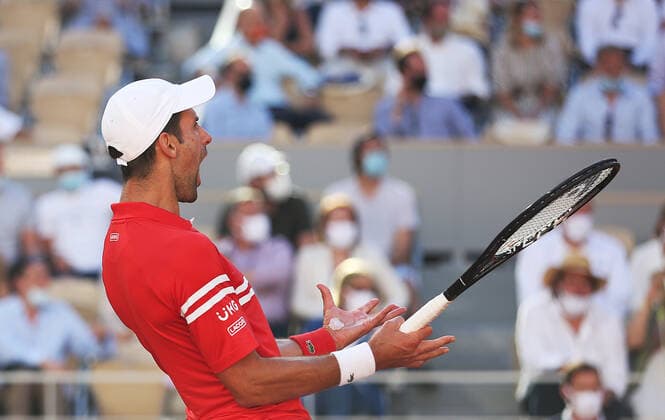 (210614) -- PARIS, June 14, 2021 -- Novak Djokovic of Serbia reacts during the Men s Singles finals match against Stefanos Tsitsipas of Greece at the French Open tennis tournament at Roland Garros in Paris, France, June 13, 2021. ) (SP)FRANCE-PARIS-TENNIS-ROLAND GARROS-FRENCH OPEN-MEN S SINGLES-FINALS GaoxJing 