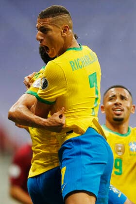 (210614) -- BRASILIA, June 14, 2021 -- Brazil s Richarlison (front) celebrates during the Group B match between Brazil and Venezuela at the 2021 Copa America in Brasilia, Brazil, June 13, 2021. Lucio Tavora) (SP)BRAZIL-BRASILIA-FOOTBALL-COPA AMERICA-BRAZIL VS VENEZUELA e LUCIOxTAVORA 