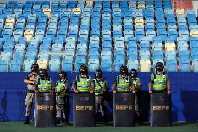 View of guards as they watch against the background of an empty tribune today, prior to a group B match of the Copa America between the teams of Paraguay and Bolivia at the Olympic Stadium in Goiania, Brazil 14 June 2021. Paraguay - Bolivia !ACHTUNG: NUR REDAKTIONELLE NUTZUNG!  Copyright: xALBERTOxVALDESx AME5740 20210615-637593201495778497