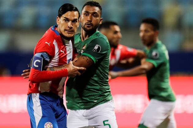 Paraguay s Gustavo Gomez (L) in action against Bolivia s Adrian Jusino, during a match for the Copa America at the Pedro Ludovico Teixeira Olympic Stadium, in Goiania, Brazil, 14 June 2021. Paraguay - Bolivia !ACHTUNG: NUR REDAKTIONELLE NUTZUNG!  Copyright: xJoedsonxAlvesx AMDEP4228 20210615-637593219288976003