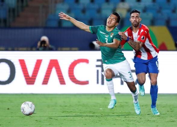 Gabriel Avalos of Paraguay disputes a ball with Jose Sagredo of Bolivia today, in a match of group B of the Copa America between the teams of Paraguay and Bolivia at the Olympic Stadium in Goiania, Brazil 14 June 2021. Paraguay - Bolivia !ACHTUNG: NUR REDAKTIONELLE NUTZUNG!  Copyright: xALBERTOxVALDESx AME5767 20210615-637593231496427379