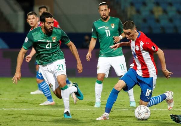 Miguel Almiron from Paraguay disputes a ball with Erwin Junior Sanchez from Bolivia today, in a match of group B of the Copa America between the teams of Paraguay and Bolivia at the Olympic Stadium in Goiania, Brazil 14 June 2021. Paraguay - Bolivia !ACHTUNG: NUR REDAKTIONELLE NUTZUNG!  Copyright: xALBERTOxVALDESx AME5808 20210615-637593274325187317