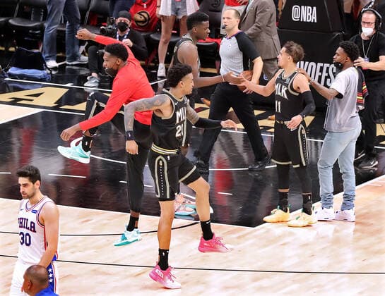 June 14, 2021, Atlanta, GA, USA: Atlanta Hawks players John Collins (from left), Clint Capela, and Trae Young along with teammates celebrate a 103-100 victory over the Philadelphia 76ers to even the series 2-2 as 76ers guard Furkan Korkmaz walks off the court in game 4 of their NBA, Basketball Herren, USA Eastern Conference semifinals series on Monday, June 14, 2021, in Atlanta. Atlanta USA - ZUMAm67_ 0121512865st Copyright: xCurtisxComptonx