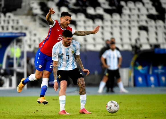 RIO DE JANEIRO, BRAZIL - JUNE 14: Rodrigo De Paul of Argentina competes for the ball with Charles Aranguiz of Chile ,during the match between Argentina and Chile as part of Conmebol Copa America Brazil 2021 at Estadio Olimpico Nilton Santos on June 14, 2021 in Rio de Janeiro, Brazil. SPO, SOC, FOC, FOI, ICH 