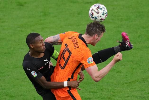 (210618) -- AMSTERDAM, June 18, 2021 -- David Alaba (L) of Austria vies with Wout Weghorst of the Netherlands during the UEFA EURO, EM, Europameisterschaft,Fussball 2020 Championship Group C match in Amsterdam, the Netherlands, June 17, 2021. ) (SP)NETHERLANDS-AMSTERDAM-FOOTBALL-EURO 2020-NED VS AUT ZhengxHuansong 