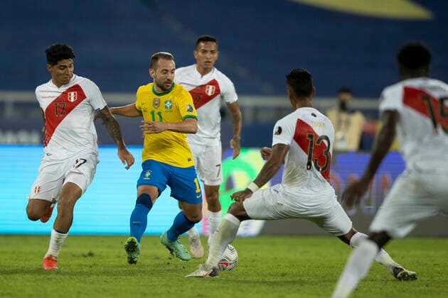 17th June 2021; Nilton Santos Stadium, Rio de Janeiro, Brazil; Copa America, Brazil versus Peru; & xc9;verton Ribeiro of Brazil takes on Luis Iberico and Renato Tapia of Peru  ActionPlus12297264 LucasxFigueiredo