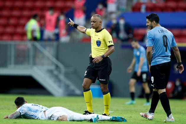 18th June 2021; Mane Garrincha Stadium, Brasilia, Distrito Federal, Brazil; Copa America, Argentina versus Uruguay; Referee Wilton Pereira Sampaio checks on the injury to Luis Su& xe1;rez of Uruguay  ActionPlus12297564 AdalbertoxMarques