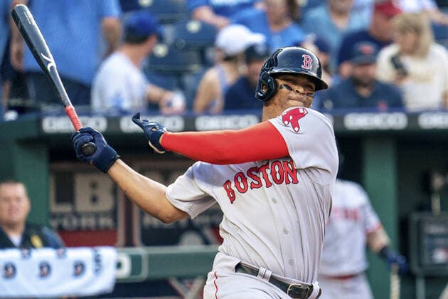 Boston Red Sox third baseman Rafael Devers (11) misses a Kansas City Royals pitch in the second inning at Kaufman Stadium in Kansas City, Missouri on Friday, June 18, 2021.  KCP20210618110 KYLExRIVAS