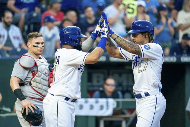 Kansas City Royals shortstop Adalberto Mondesi (27) celebrates with first baseman Carlos Santana (41) after connecting for a three run home run against the Boston Red Sox in the third inning at Kaufman Stadium in Kansas City, Missouri on Friday, June 18, 2021.  KCP20210618118 KYLExRIVAS