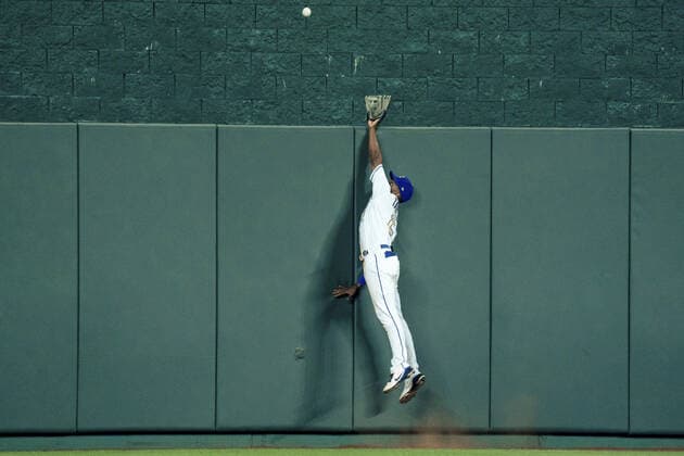 Boston Red Sox third baseman Rafael Devers (11) hits a home run past the glove of Kansas City Royals center fielder Michael A. Taylor (2) in the eighth inning at Kaufman Stadium in Kansas City, Missouri on Friday, June 18, 2021.  KCP20210618122 KYLExRIVAS