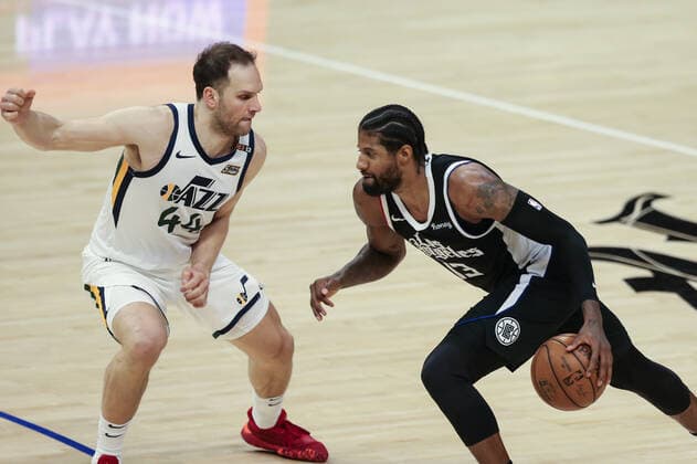 LOS ANGELES, CA - JUNE 18: LA Clippers guard Paul George (13) driving on Utah Jazz forward Bojan Bogdanovic (44) during game 6 of the second round of the Western Conference Playoffs between the Utah Jazz and the Los Angeles Clippers on June 18, 2021, at Staples Center in Los Angeles, CA. (Photo by Jevone Moore Icon Sportswire) NBA, Basketball Herren, USA JUN 18 Western Conference Playoffs Second Round - Jazz at Clippers Icon2106181048