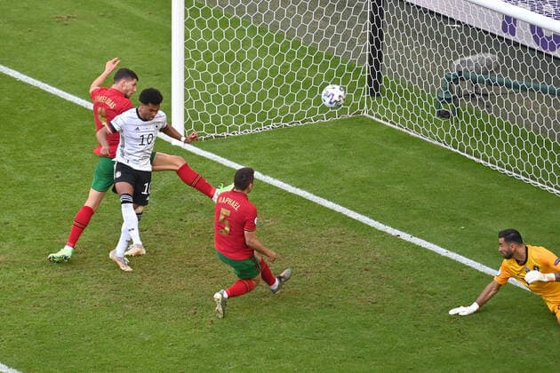 Goal to 1 2 by an own goal by Ruben DIAS POR ,Centre involving Serge GNABRY GER and Ruben DIAS POR Penalty area action, On the ground Rui PATRICIO, Goalkeeper POR Group Stage,Preliminary Round Group F, Match M24, Portugal POR Germany GER on 19 06 2021 in Munich Football Arena Allianz Arena European Football Championship 2020 from 11 06 2021 11 07 2021