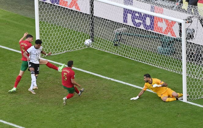 Own goal by Raphael Guerreiro Portugal , 2 v re , to 1 2, Serge Gnabry Germany left 19 06 2021, European Football Championship 2021, preliminary round, 2 match day, Group F, Portugal Germany 2 4, photo Maik Hölter TEAM2sportphoto Muenchen Allianz Arena Bayern Germany. Team2