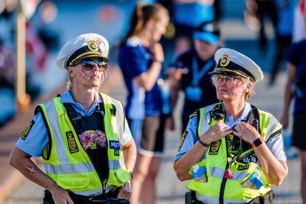 Football fans in Copenhagen Copenhagen, Denmark. 17th, June 2021. Danish police officers have red and white flags painted on their cheeks before the UEFA EURO, EM, Europameisterschaft,Fussball 2020 match between Denmark and Belgium in Copenhagen. Copenhagen Denmark  Copyright: xGonzalesxPhoto RobertxHendelx