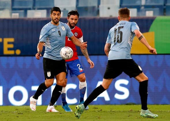 CUIABA, BRAZIL - JUNE 21: Luis Suarez of Uruguay competes for the ball with Eugenio Mena of Chile ,during the match between Uruguay and Chile as part of Conmebol Copa America Brazil 2021 at Arena Pantanal on June 21, 2021 in Cuiaba, Brazil. SPO, SOC, ICH 